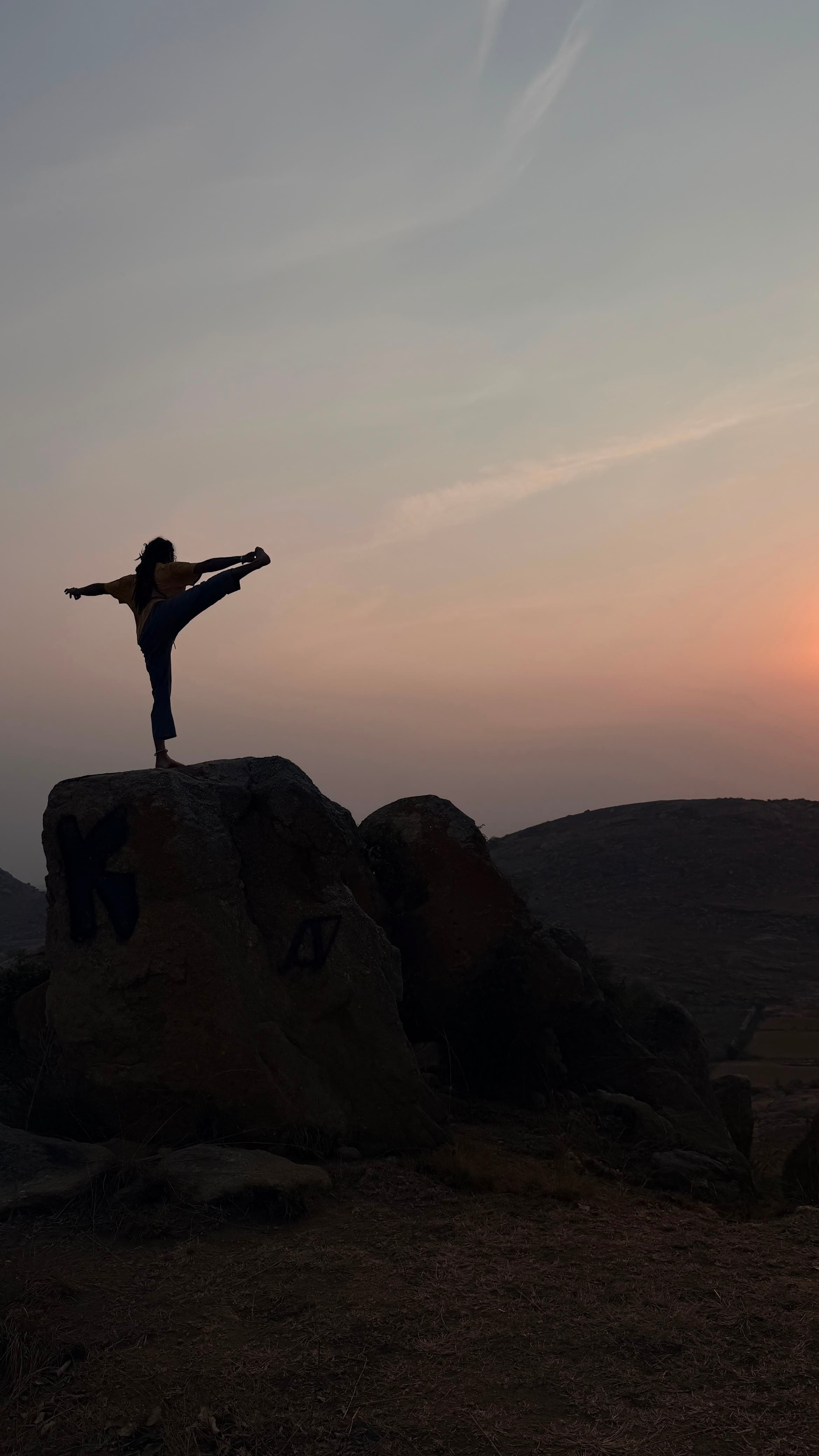 Yoga practice at sunset in the mountains