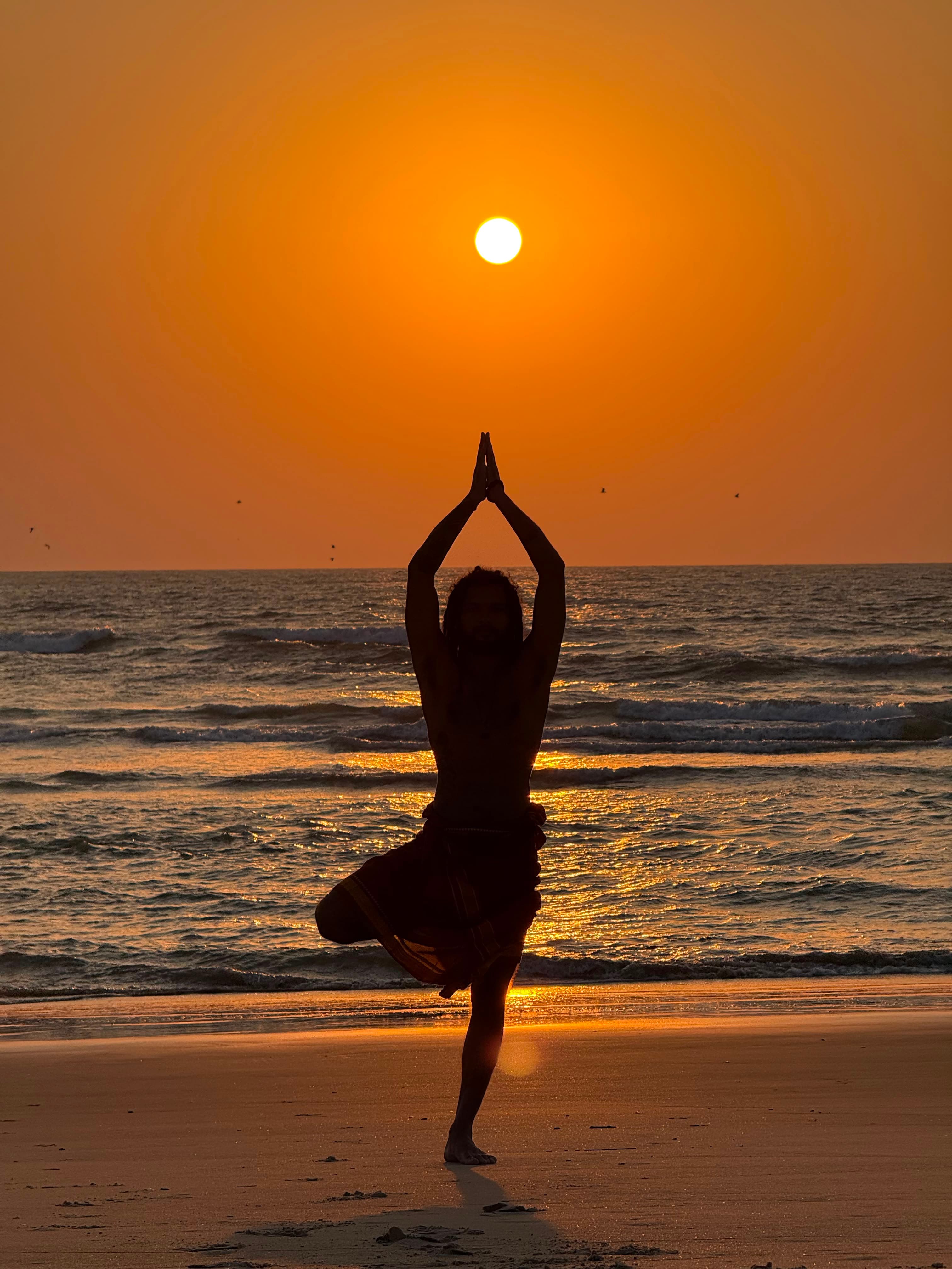 Sunrise yoga by the sea